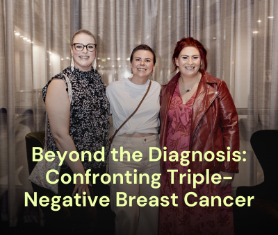 Three women standing side by side smiling at the camera